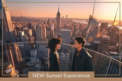 Nova experiência de pôr do sol em Nova York com casal admirando a vista icônica da cidade ao entardecer. O cenário urbano e romântico do rooftop ideal para viagens e momentos inesquecíveis.